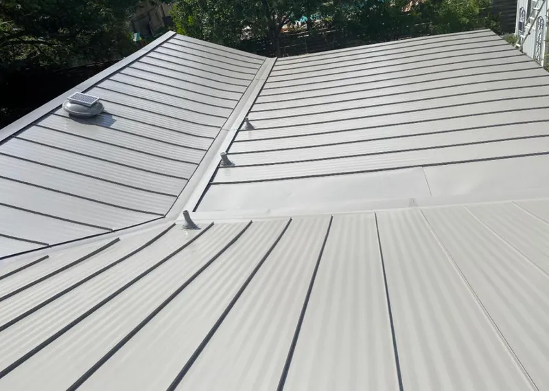 Solar attic fan installed on a metal roof for Roof Ventilation in Ruskin